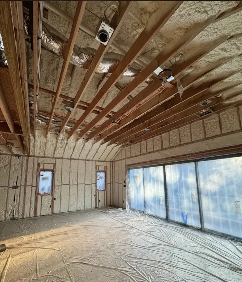 Interior walls and ceiling insulated with spray foam during new construction in Chevy Chase